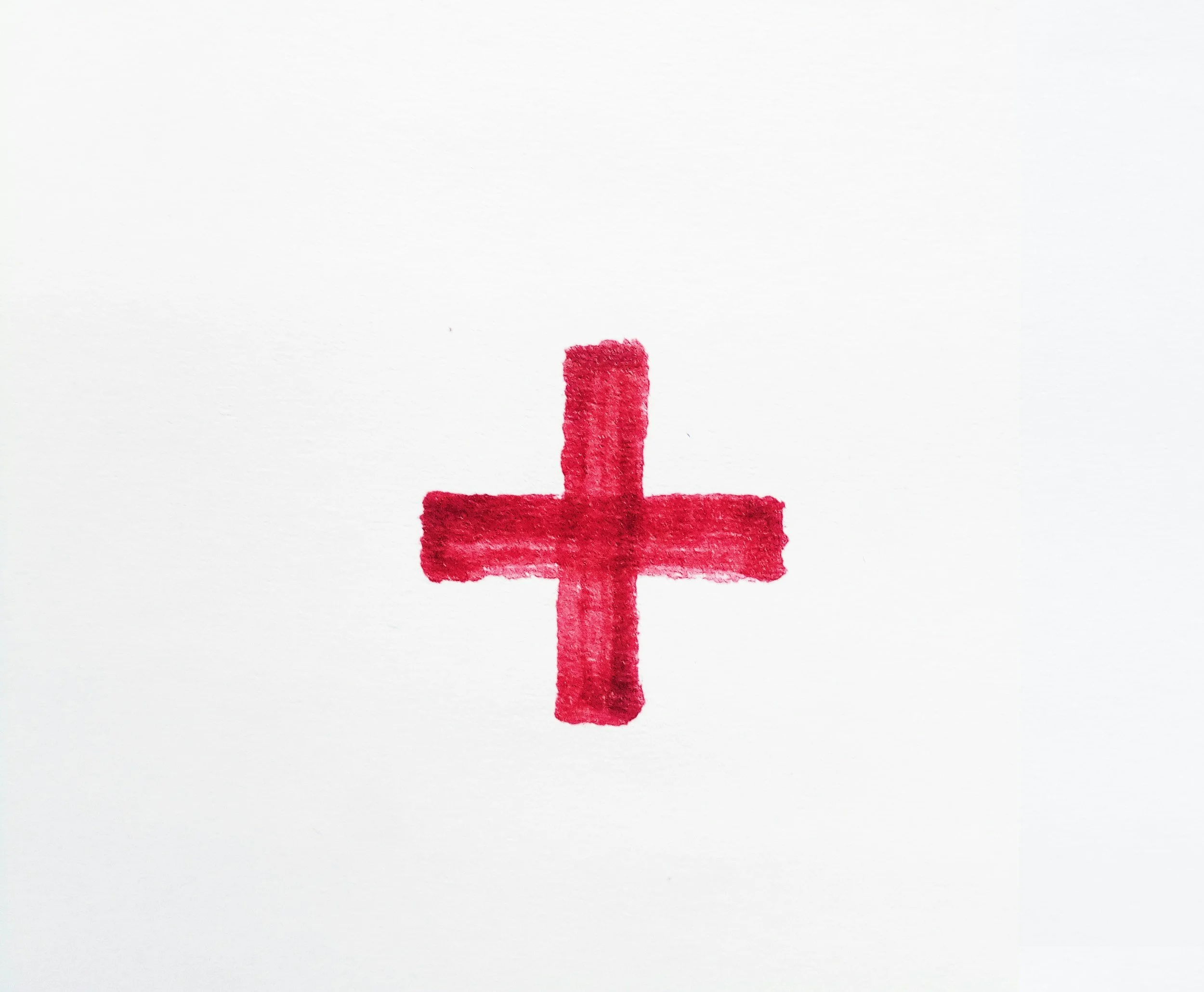 Red watercolor plus sign on white background.